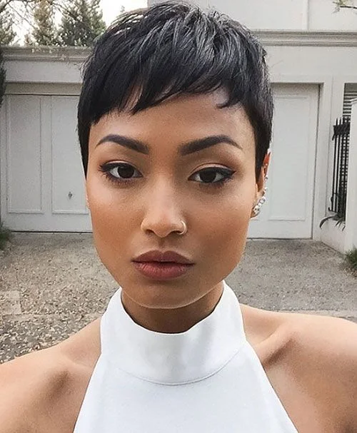 ear straight chestnut pixie with side swept fringe shown as a baby bangs idea