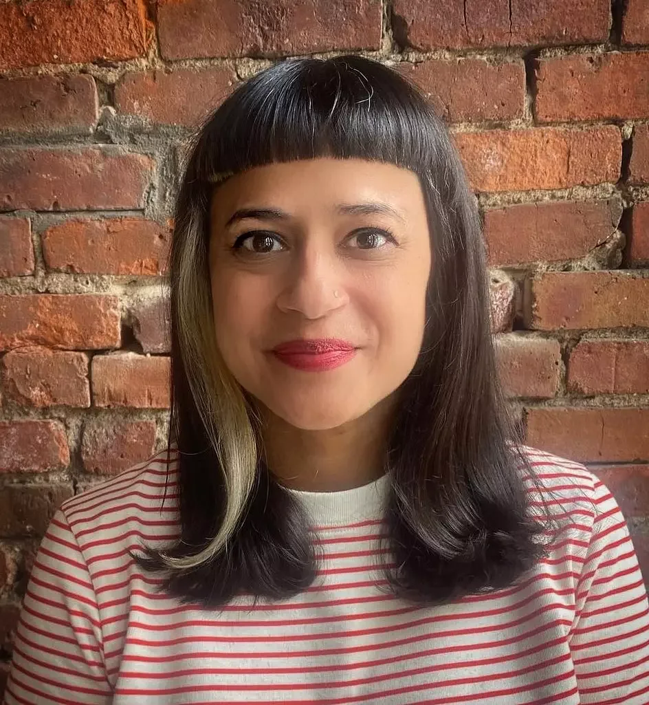 shoulder wavy pink shag with blunt fringe shown as a baby bangs idea