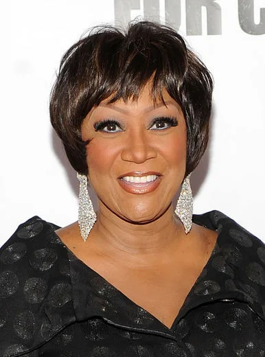 Soft side-swept pixie bob with bangs for a round face