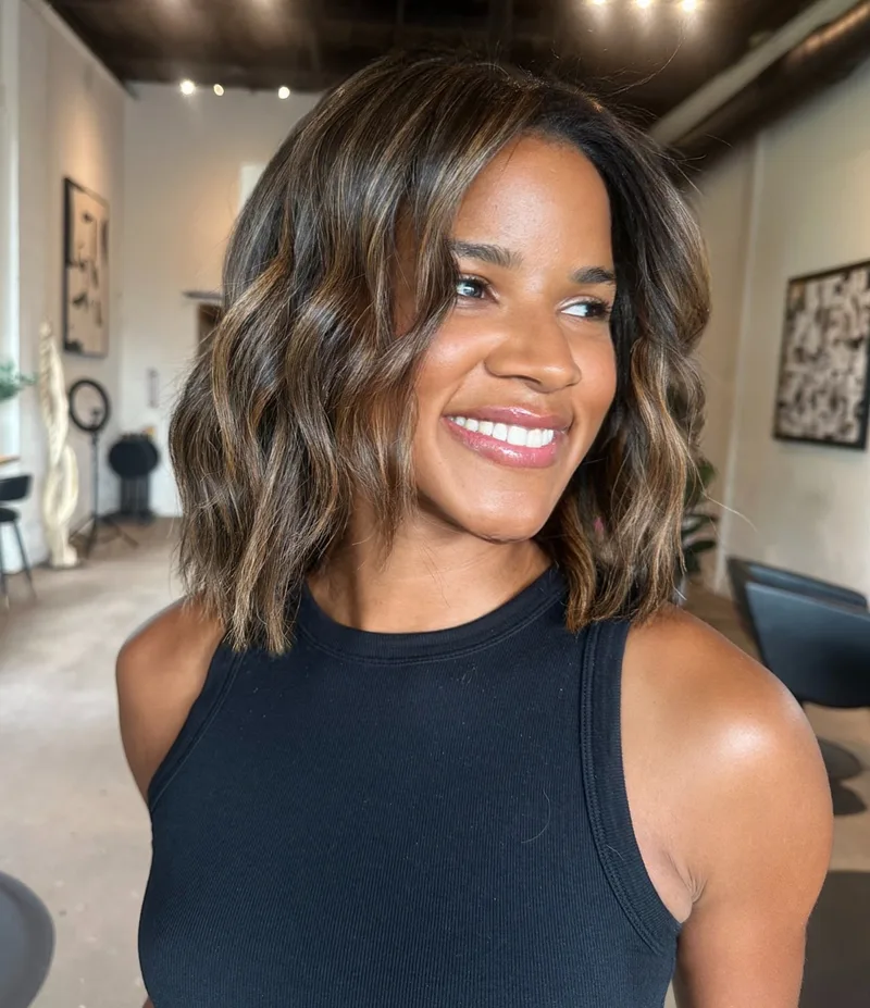 Shoulder-length brown hair with loose waves