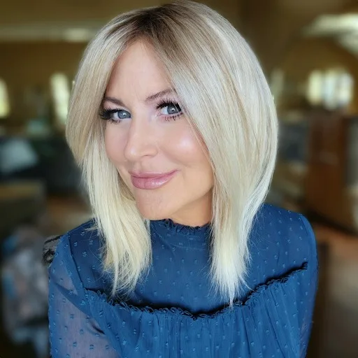 Straight blonde hair reaching below the shoulders