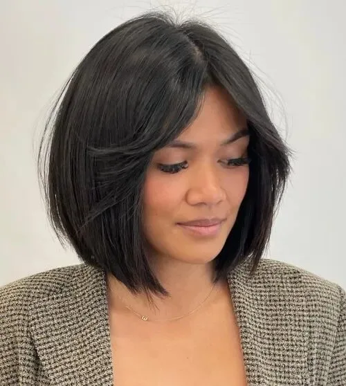 Dark chin-length bob with a side part