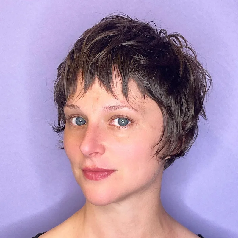 Short brunette textured hairstyle with separated top layers