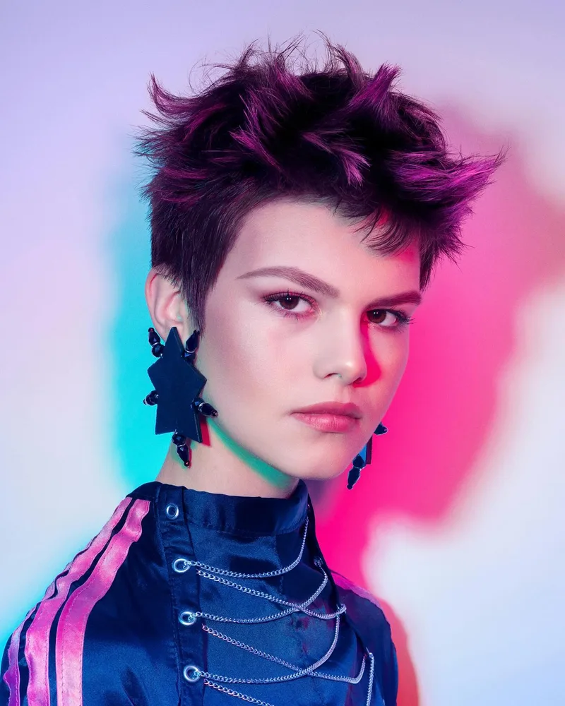 Short dark magenta pixie with separated spiky layers through the top