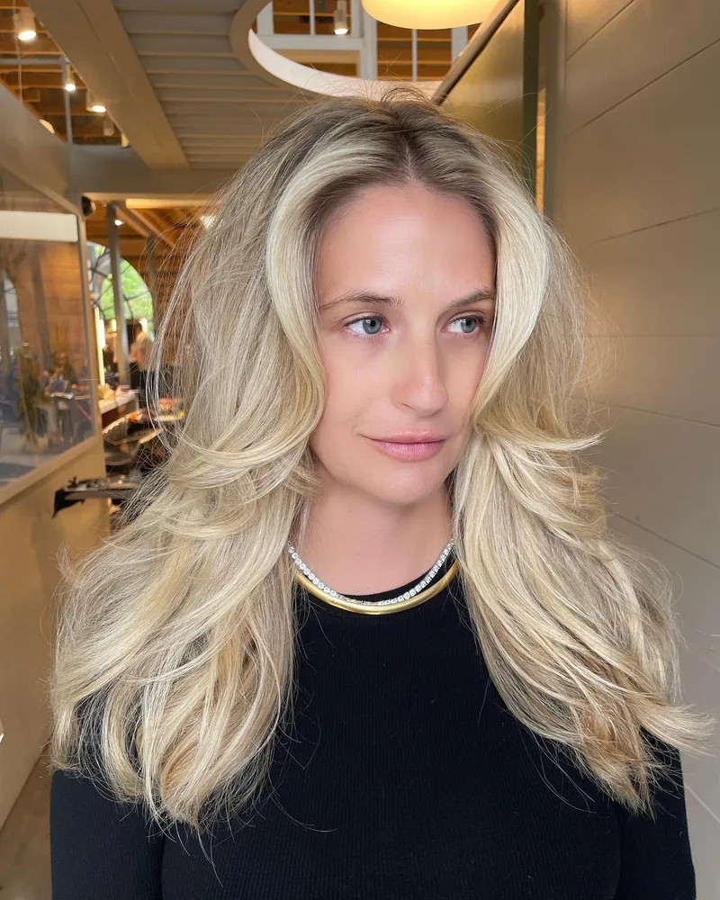 Long blonde hair arranged in smooth flowing waves