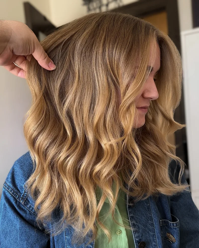 Shoulder-length highlighted hair with smooth waves