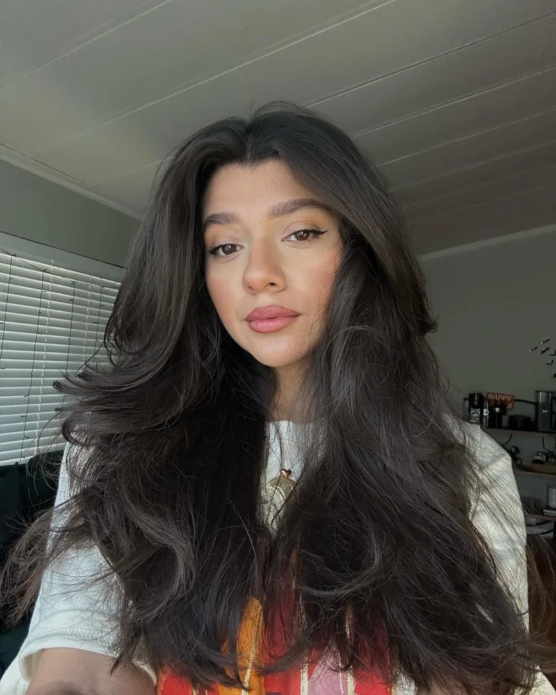 Dark layered blowout with a rounded crown