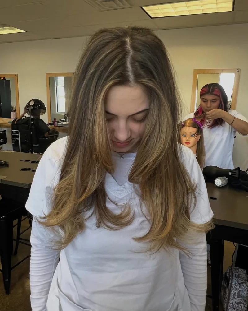 Long smooth layered blonde hair