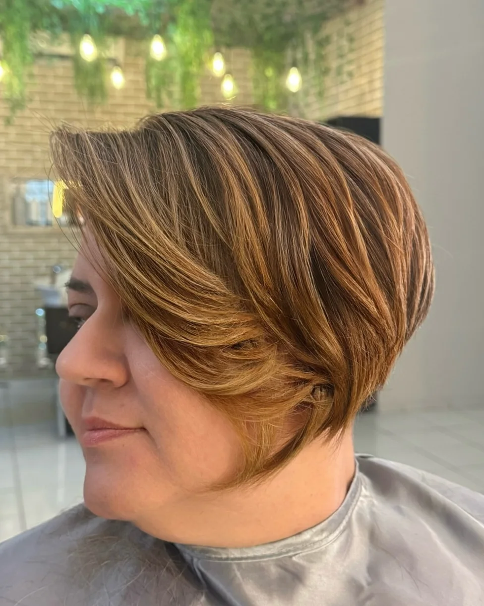 Feathered brunette bixie haircut with side-swept layers