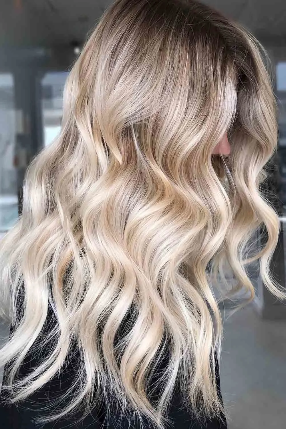 Back view of creamy pale blonde waves with a darker crown