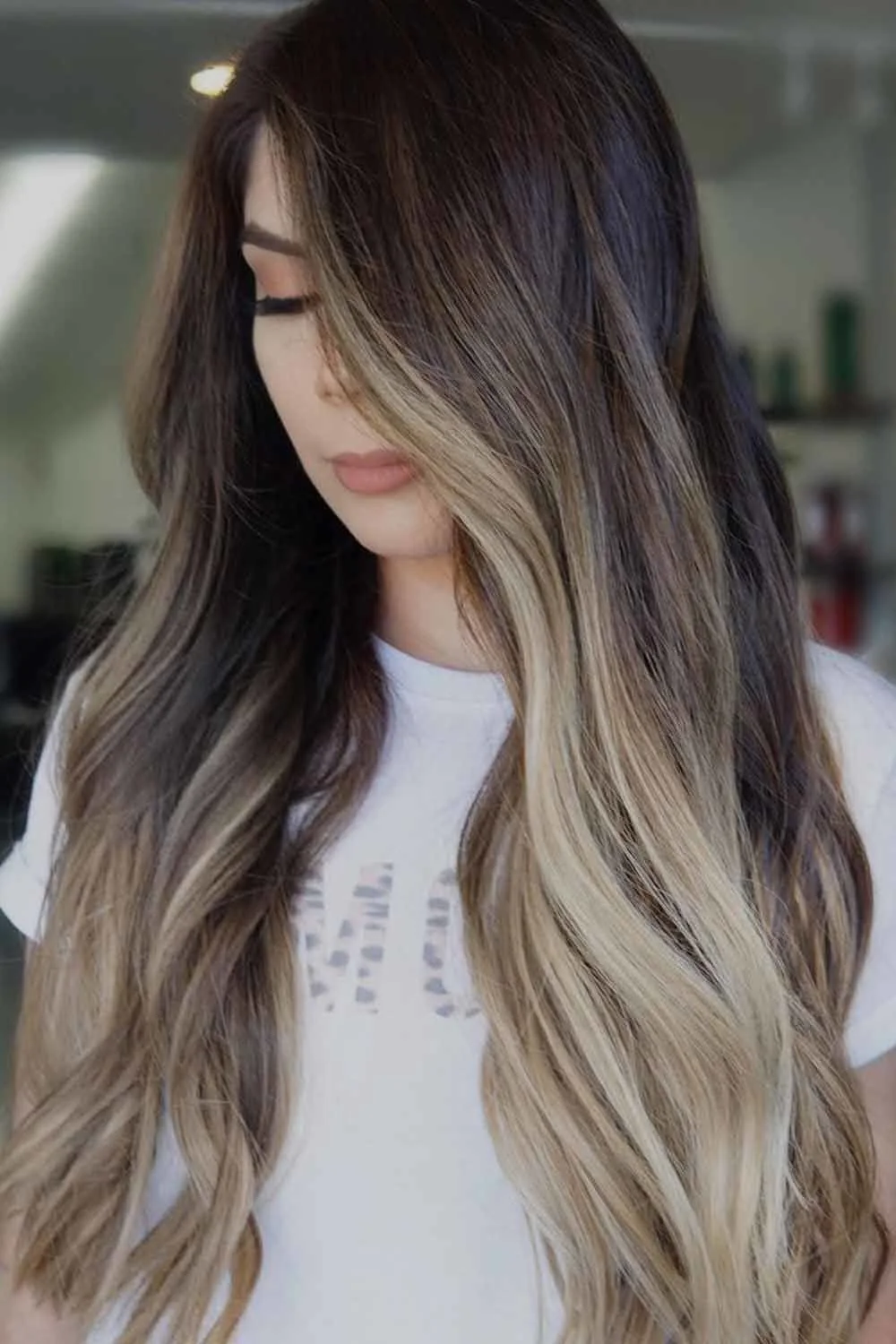 Front-side view of long hair with dark upper lengths and pale blonde front and ends