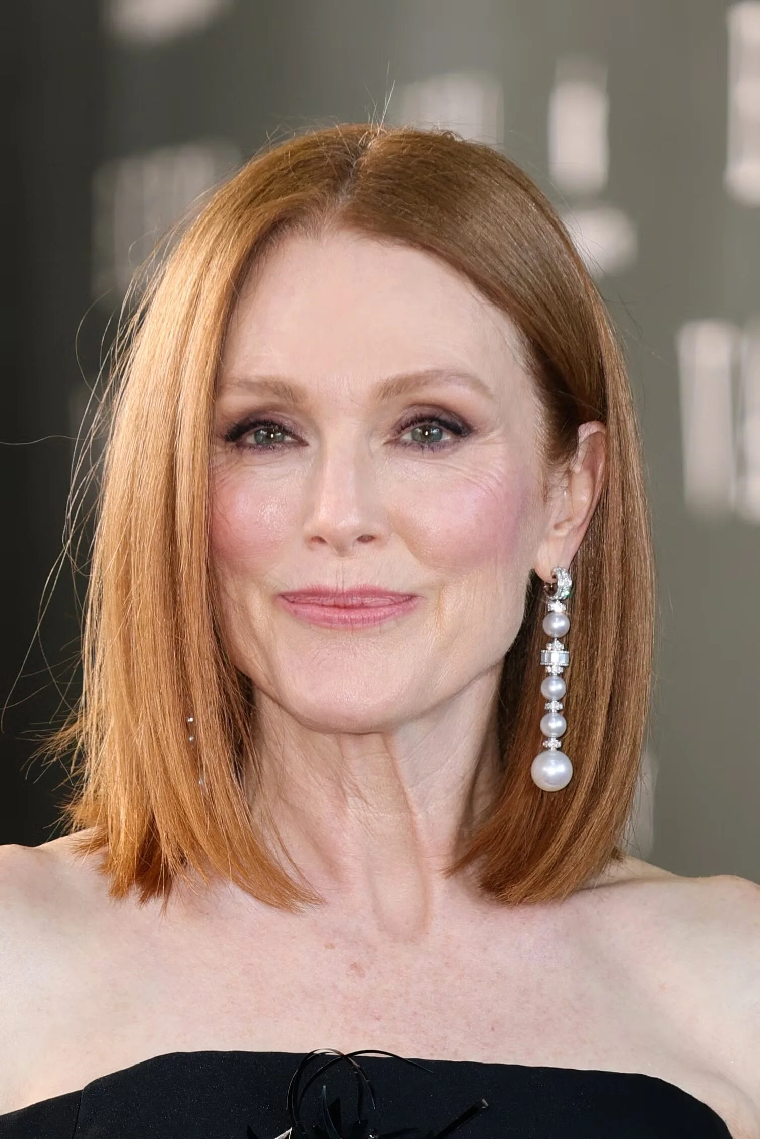 Sleek red chin-length bob with a blunt edge