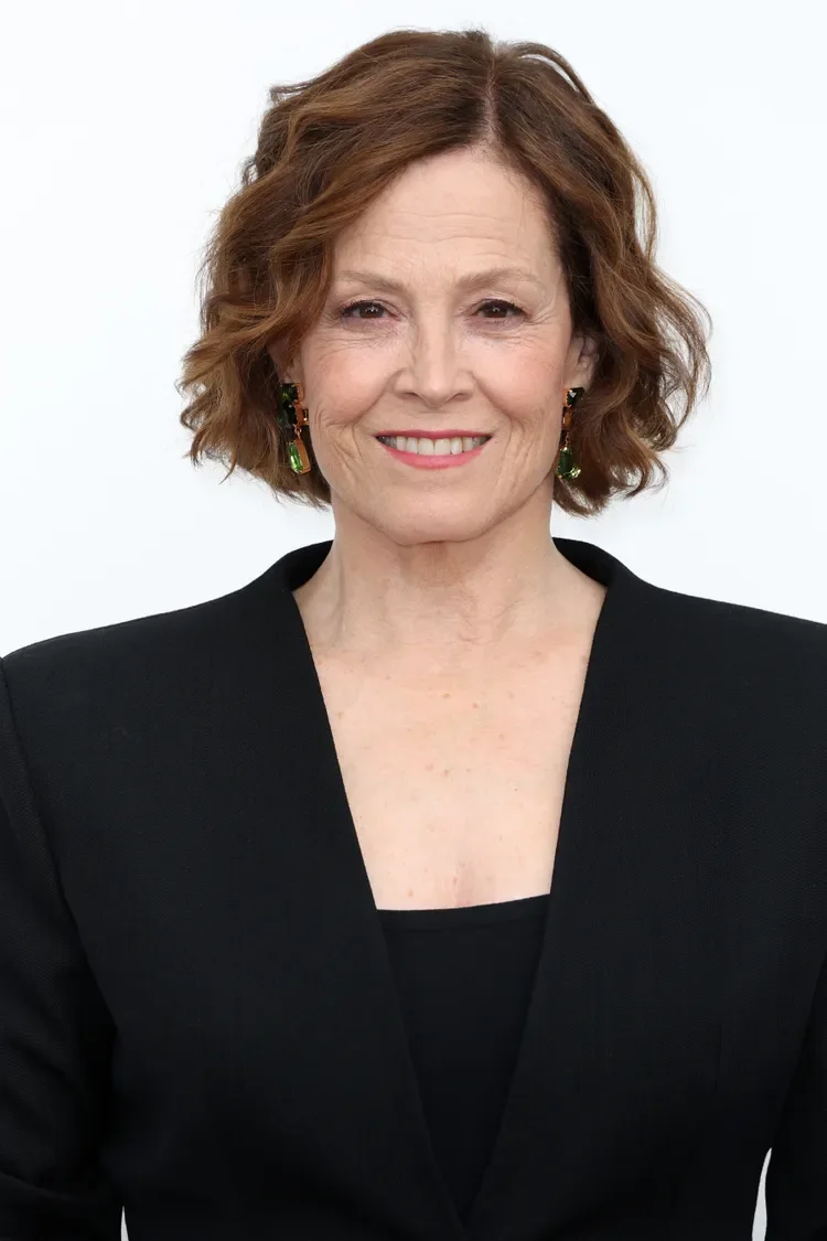 Soft red wavy neck-length bob with gentle side volume
