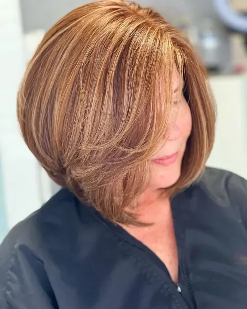 Layered blonde chin bob with face-framing side pieces