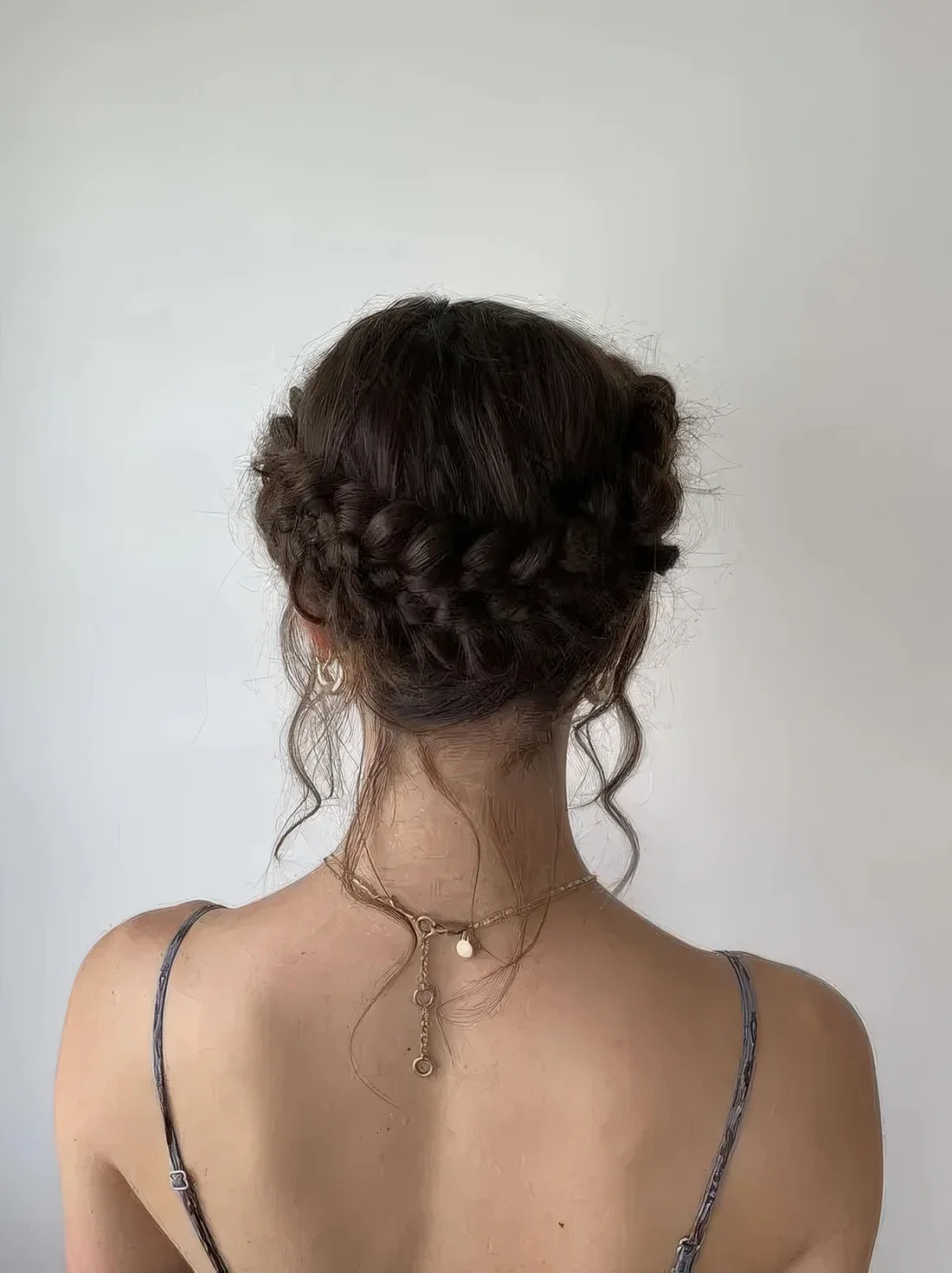 Simple braided low updo with a halo and some locks down.