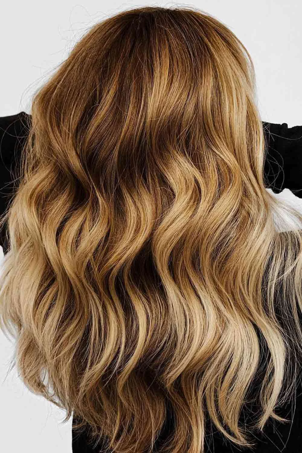 Back view of long brown hair with golden lower waves