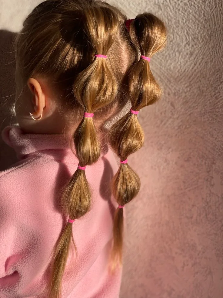 chest straight brunette ponytail shown as a bubble braid ponytail hairstyles idea