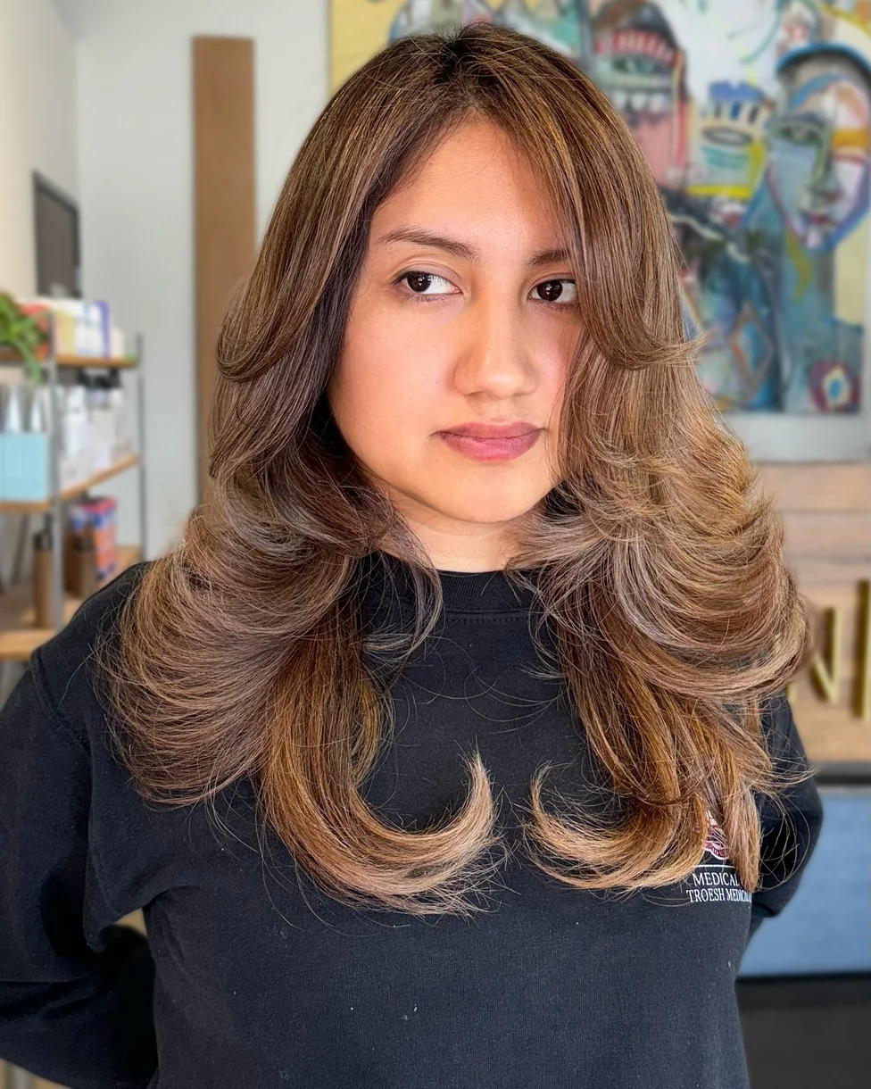 Long butterfly haircut with full layered sides and center shape