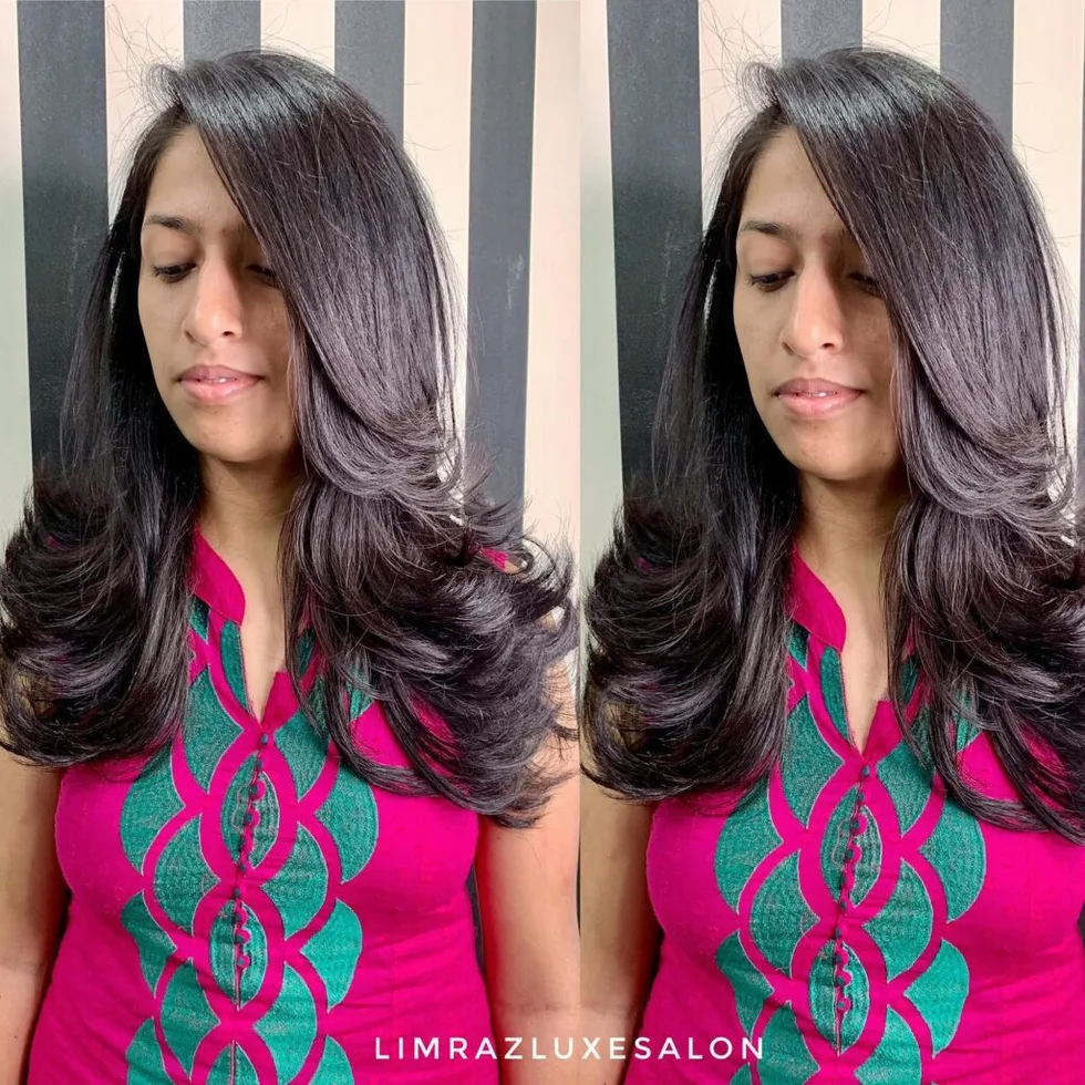Black long butterfly haircut with soft curled ends