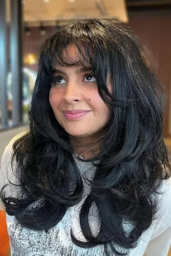 Black long butterfly haircut with airy layered volume