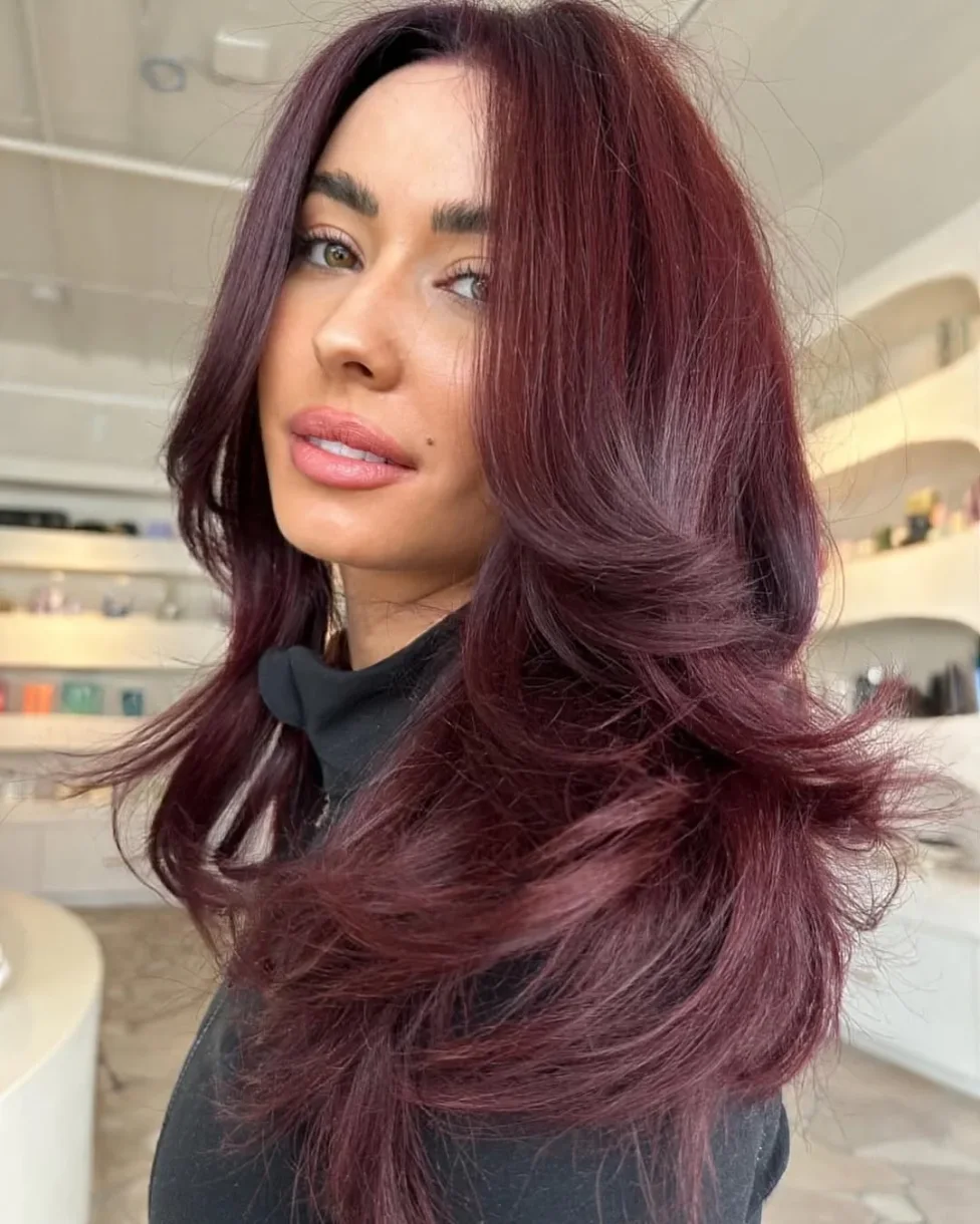 Burgundy long butterfly haircut with sweeping layers