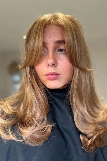 Bronde long butterfly haircut with feathered front layers