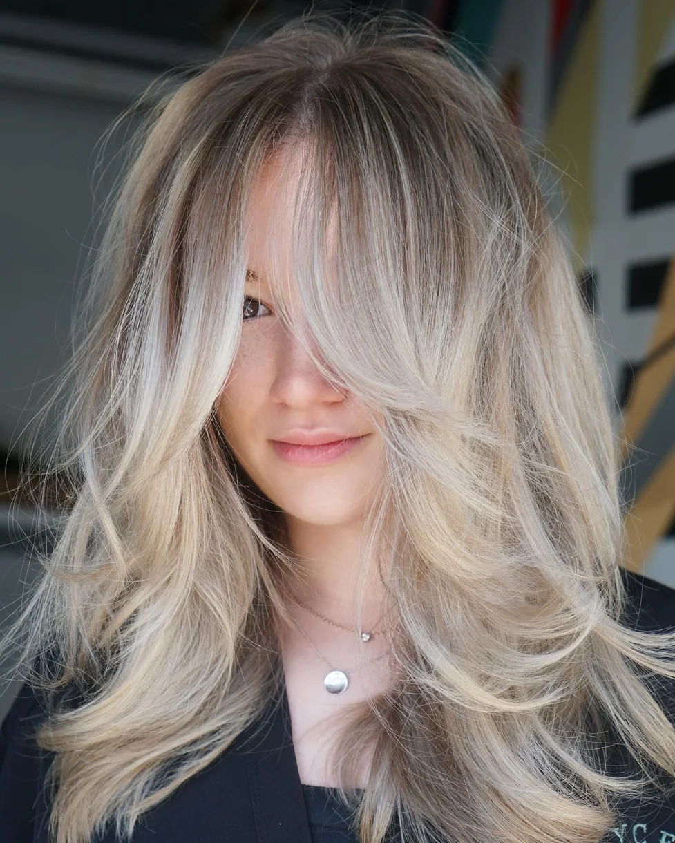 Silver blonde butterfly haircut with long soft layers