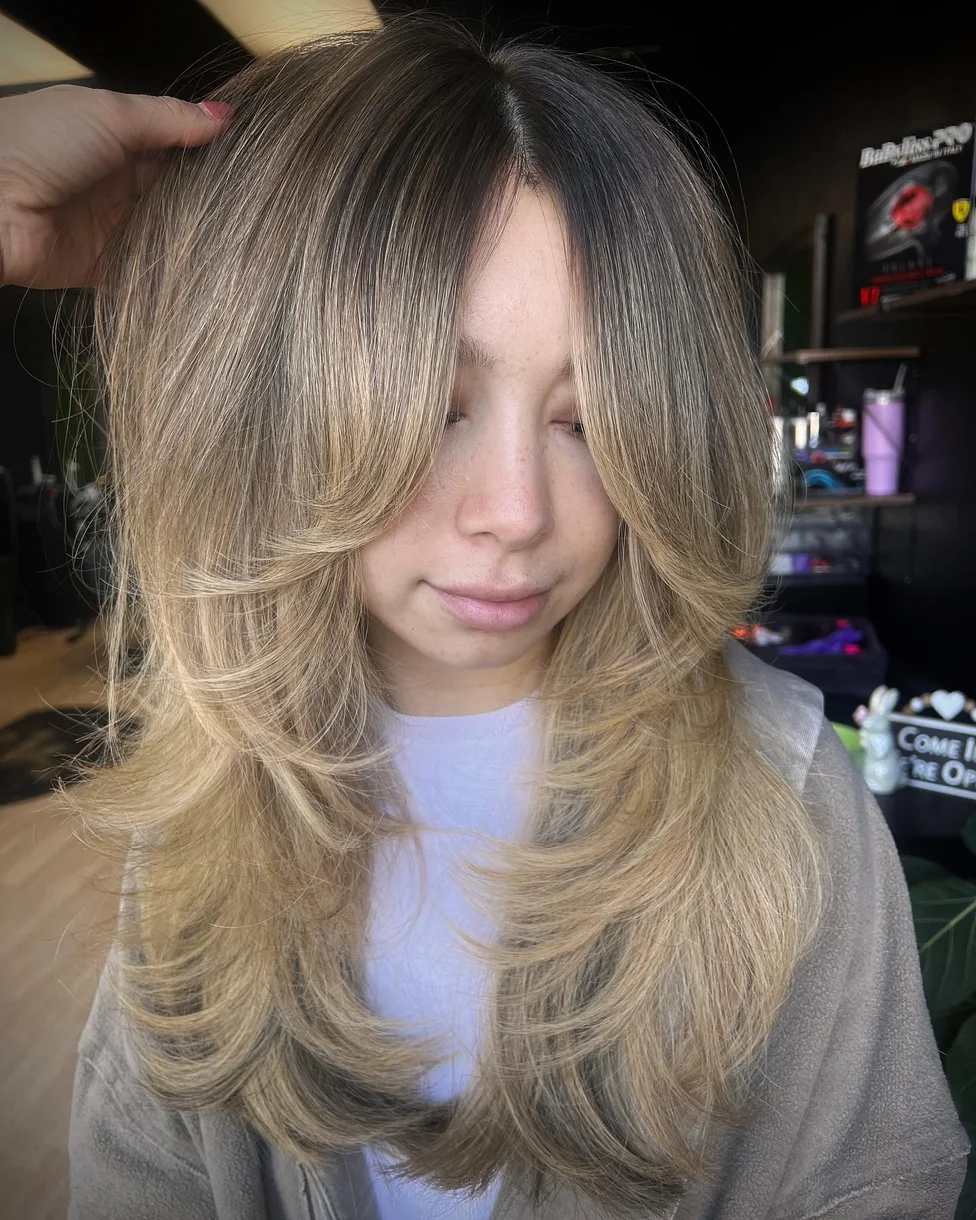 Ash blonde butterfly haircut with soft long layers