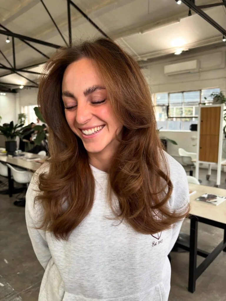 Light copper butterfly haircut with long blowout layers