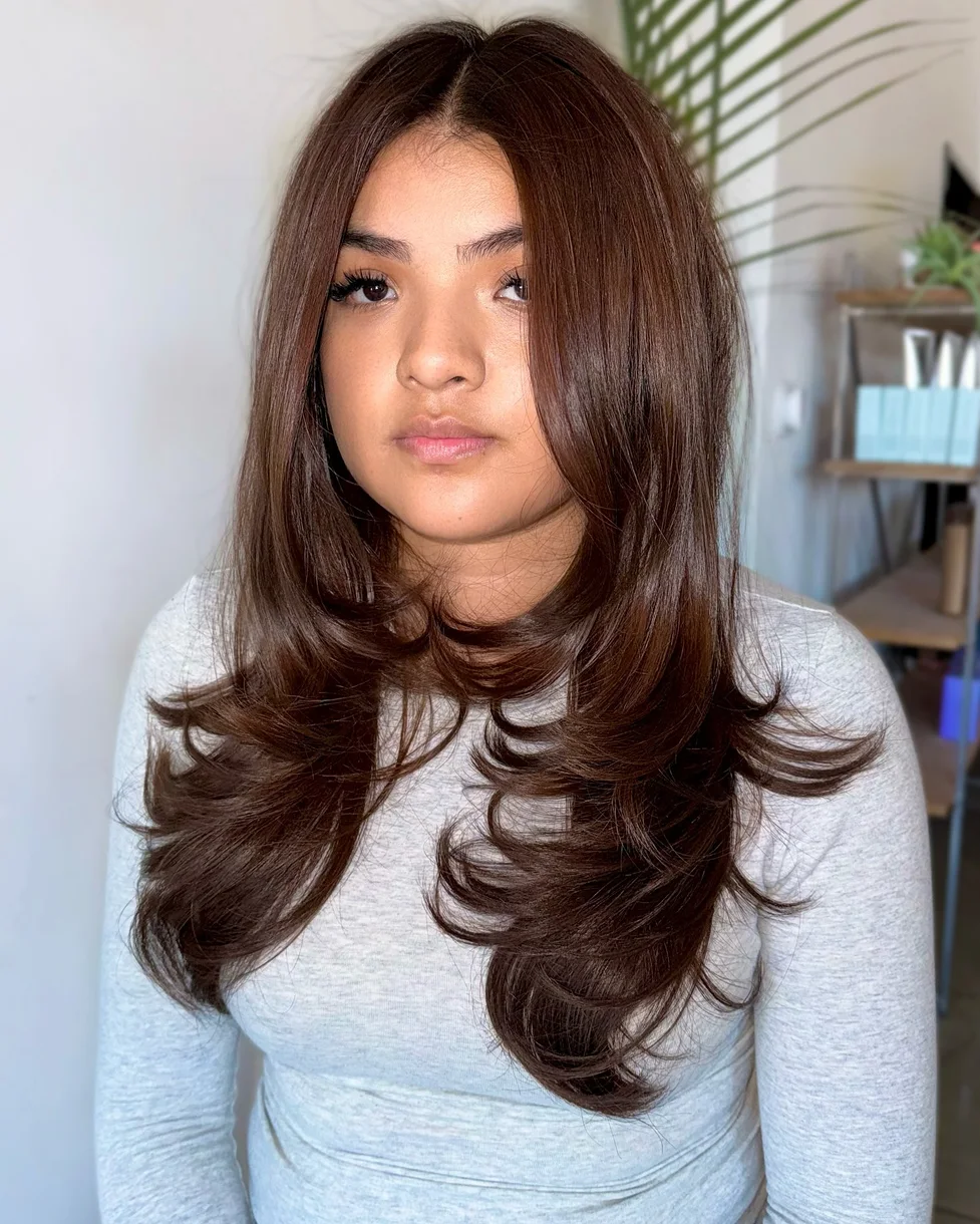 Copper brown long butterfly haircut with curled face layers