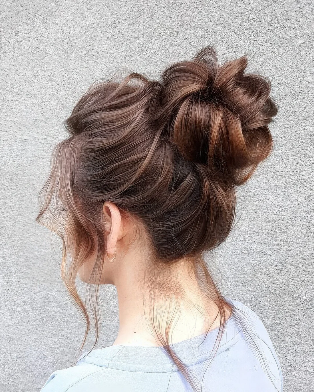 Photo showing ballerina bun hairstyle, with the hairstyle clearly visible.