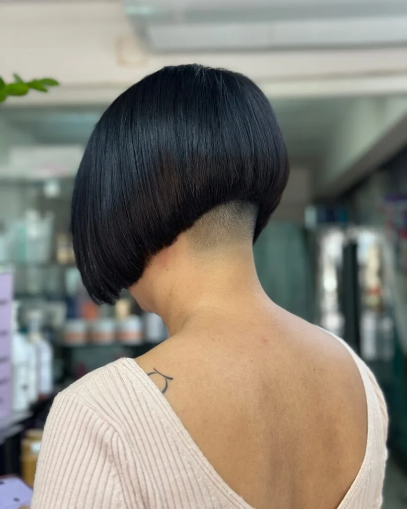 Black stacked choppy bob for fine hair with a rounded nape and clean back shape