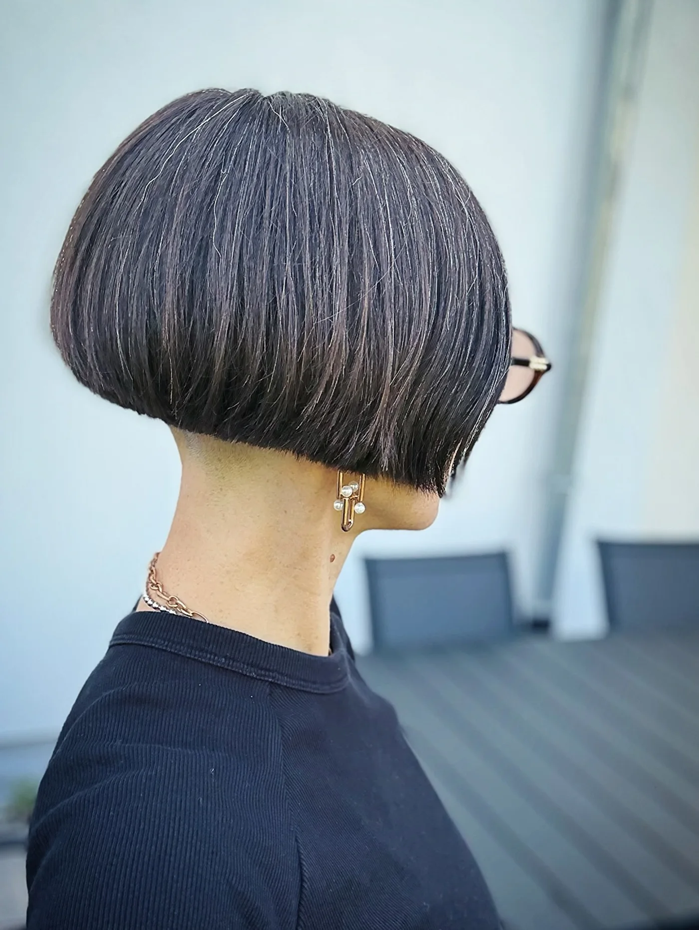 Silver cropped choppy bob for fine hair with glasses and a rounded back