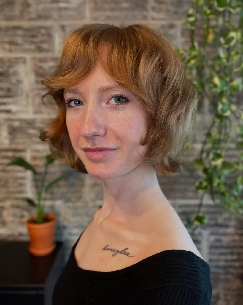 Ginger textured choppy bob for fine hair with soft curtain bangs