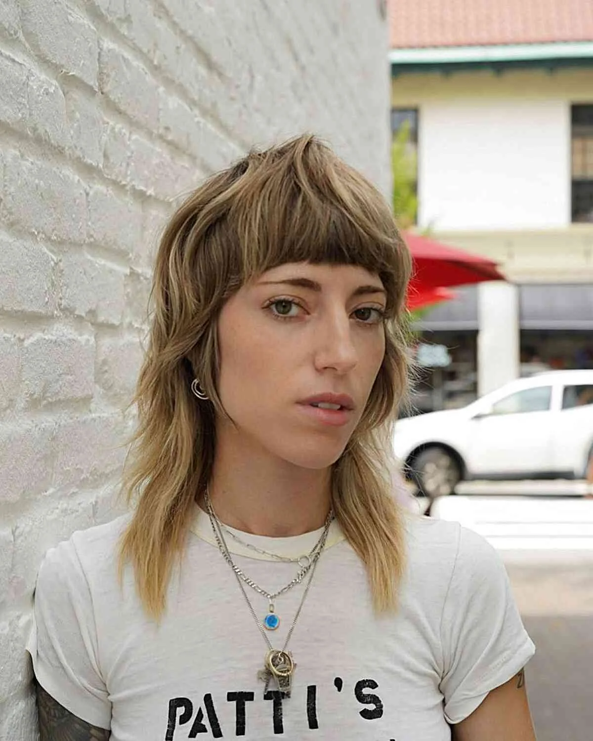 Choppy bob for fine hair with short curtain bangs and piecey ends