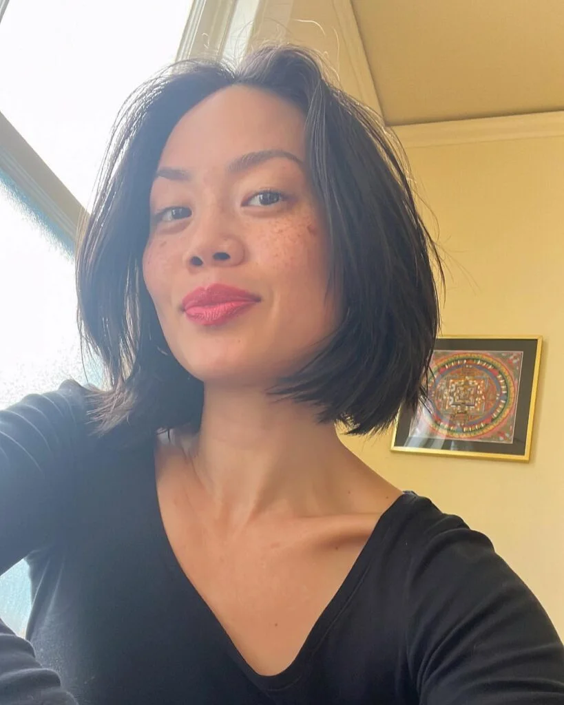 Sleek black choppy bob for fine hair with a chin-length line