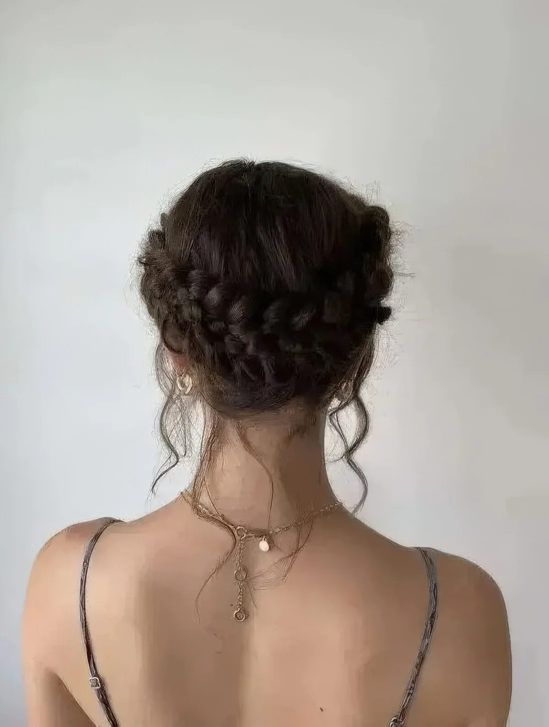 Simple braided low updo with a halo and some locks down.
