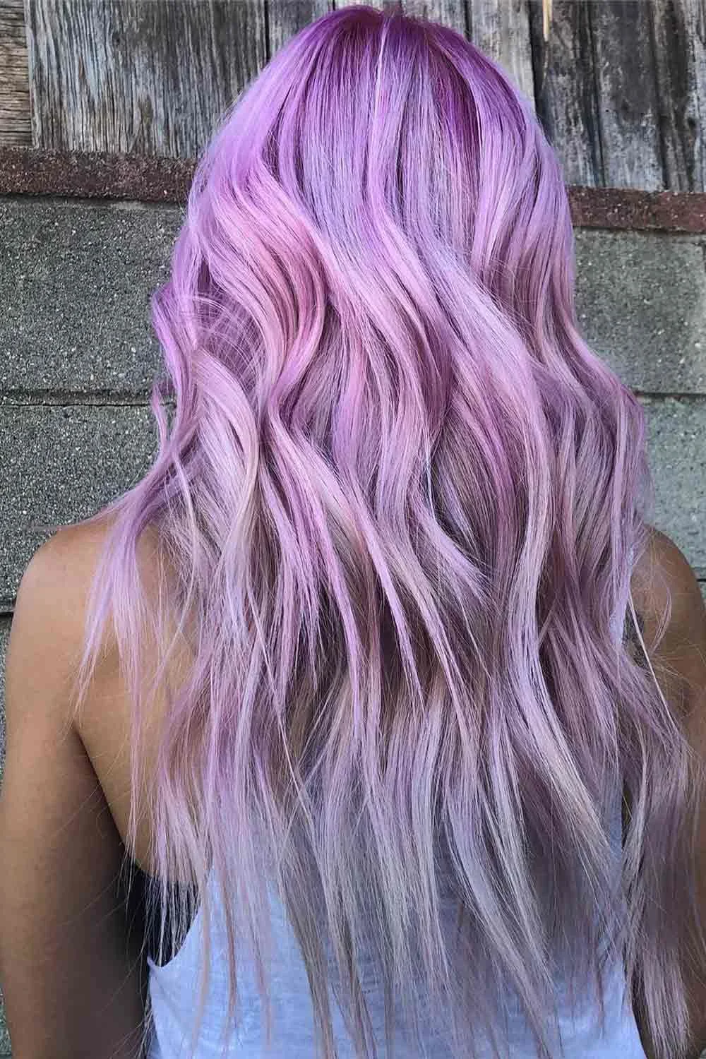 Back view of long loose waves in lavender purple that fade toward pale lilac and silver ends