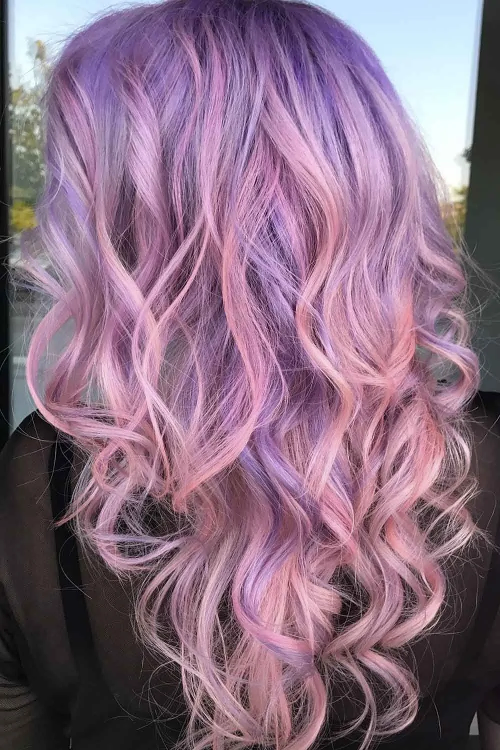 Back view of long waves blending lavender violet with soft pink and a few pale lilac strands