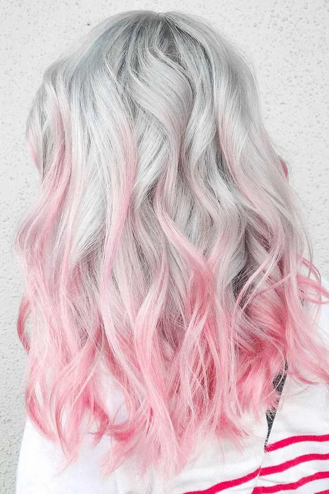 Back-side view of silver-white shoulder-length waves with a soft pink fade at the ends