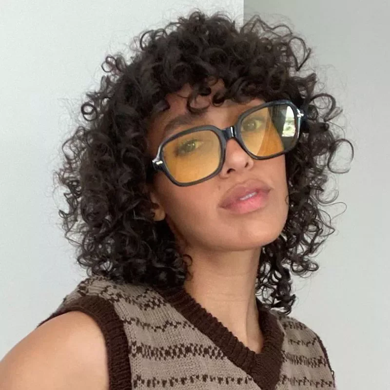 Shoulder length brunette curls with a curly fringe and round shape