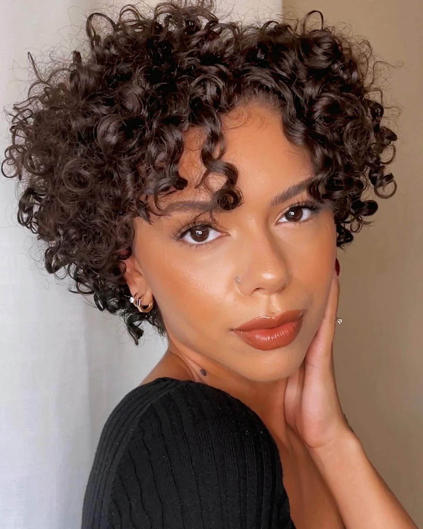 ear coily black curly style shown as a curly hairstyles ideas idea, featuring medium layering