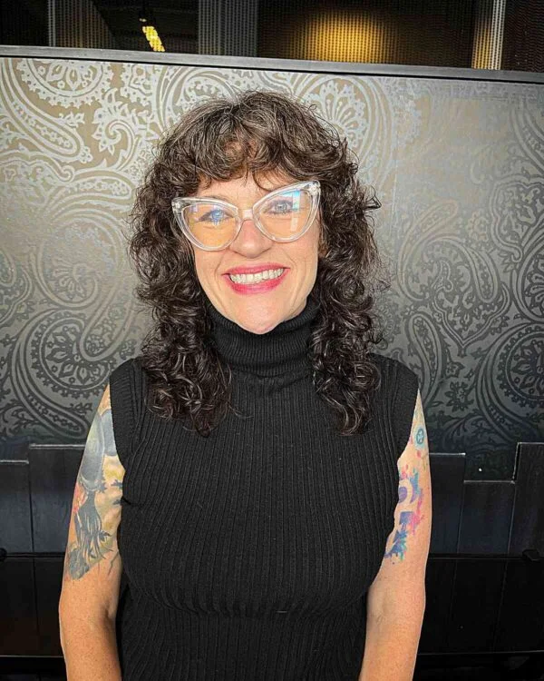 shoulder curly brunette shag with curly fringe fringe shown as a curly hairstyles ideas idea, featuring textured finish