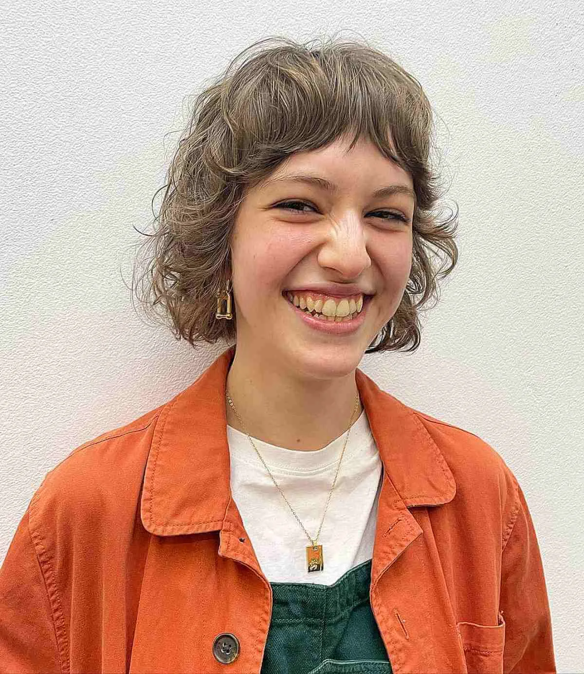 shoulder curly brunette shag with curly fringe fringe shown as a curly hairstyles ideas idea, featuring center part, shown in short curly bob with rounded fringe