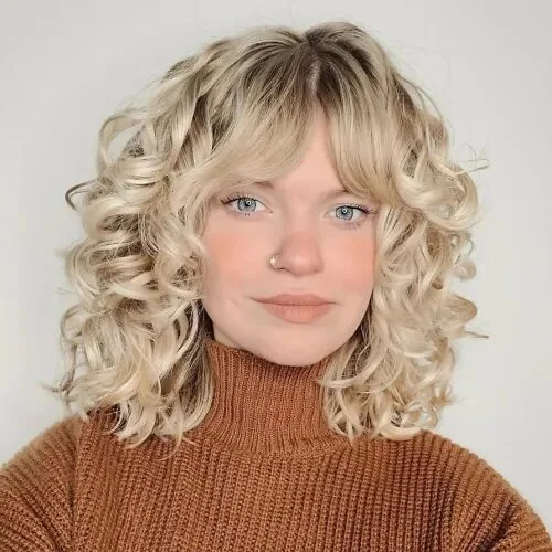 shoulder curly brunette shag with curly fringe fringe shown as a curly hairstyles ideas idea, featuring volume through the all over, shown in soft blonde curly bob