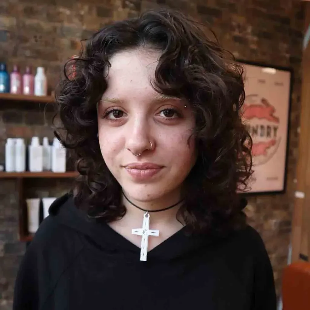 shoulder curly brunette shag with curly fringe fringe shown as a curly hairstyles ideas idea, featuring brunette color, shown in defined brunette curls with center fringe