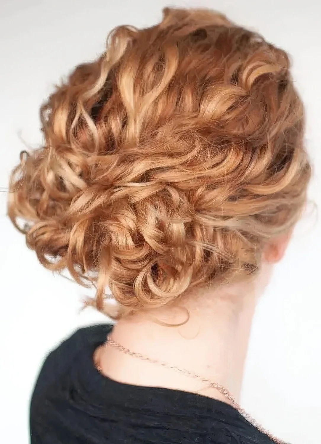 Easy curly updo with a curly top and a beautiful ginger shade.