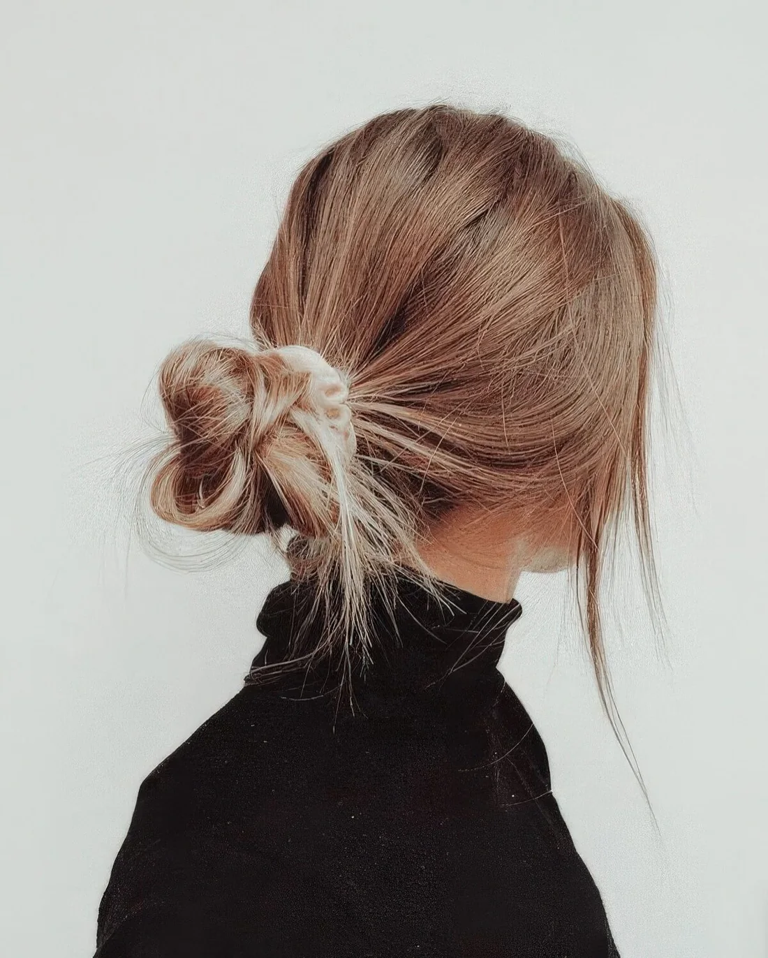 Photo showing messy bun with a scrunchie, with the hairstyle clearly visible.