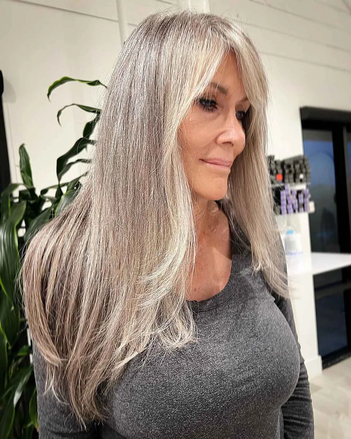chest straight gray layers with side swept fringe shown as a gray blending for older women idea