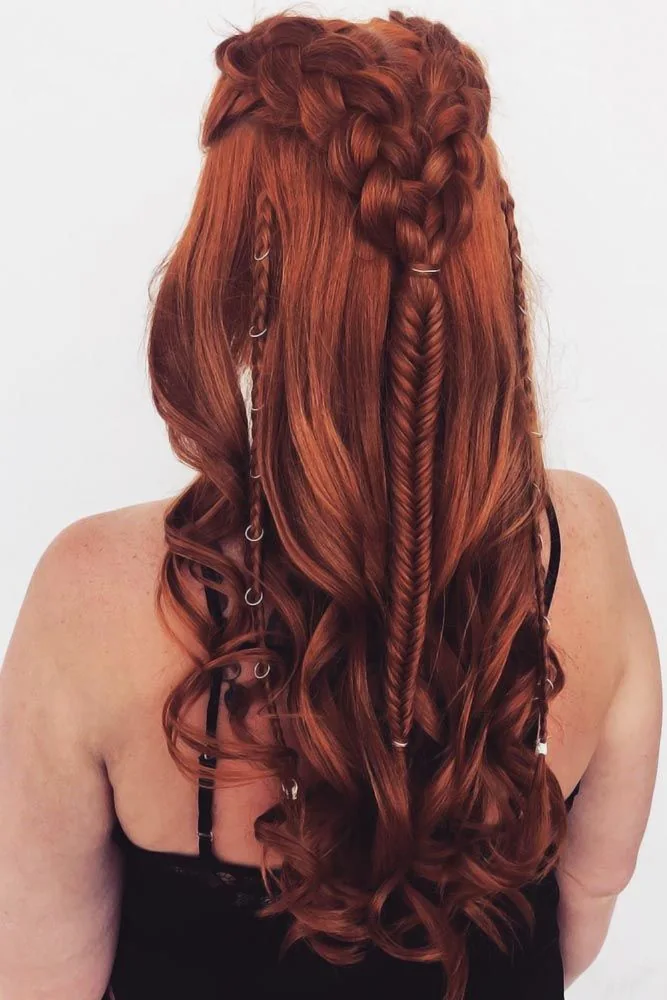 Back view of long copper hair with a central fishtail and small ringed side braids